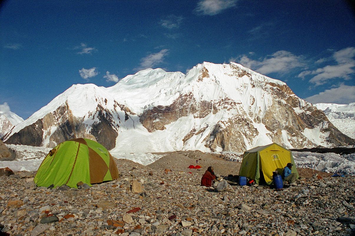 12 Shagring Camp On The Upper Baltoro Glacier With Baltoro Kangri We camped at Shagring (4853m) near the junction of the Upper Baltoro and Abruzzi Glaciers. Baltoro Kangri towers just beyond the camp. Baltoro Kangri (Golden Throne, 7312m) is an enormous dome of snow and ice capped with five summits, seen here from Concordia in the late afternoon. Baltoro Kangri V (southeast, 7260 m) was first climbed by James Belaieff, Piero Ghiglione and Andre Roch, on August 3, 1934, who then skied down from over 7000m. The other four summits were climbed by two Japanese expeditions in 1963 and 1976,